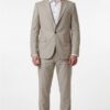 Man wearing a light beige, single‑breasted suit with a white shirt and brown loafers, standing against a white backdrop.