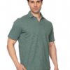 Male model wearing a muted green polo shirt against a white studio background, posing with one hand in his pocket.