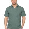 Male model wearing a sage green polo shirt and light gray pants, posing against a white studio background.