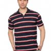 Man wearing a navy polo with red and white horizontal stripes, posing with hands in pockets.