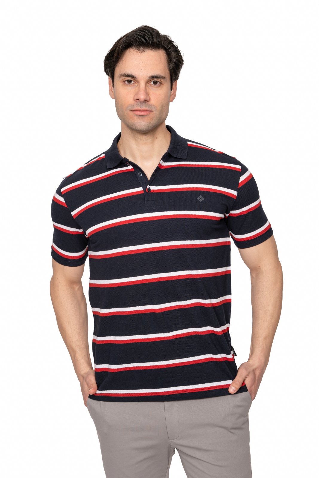 IMG_4891jpg - Noble Man wearing a navy polo with red and white horizontal stripes, posing with hands in pockets.
