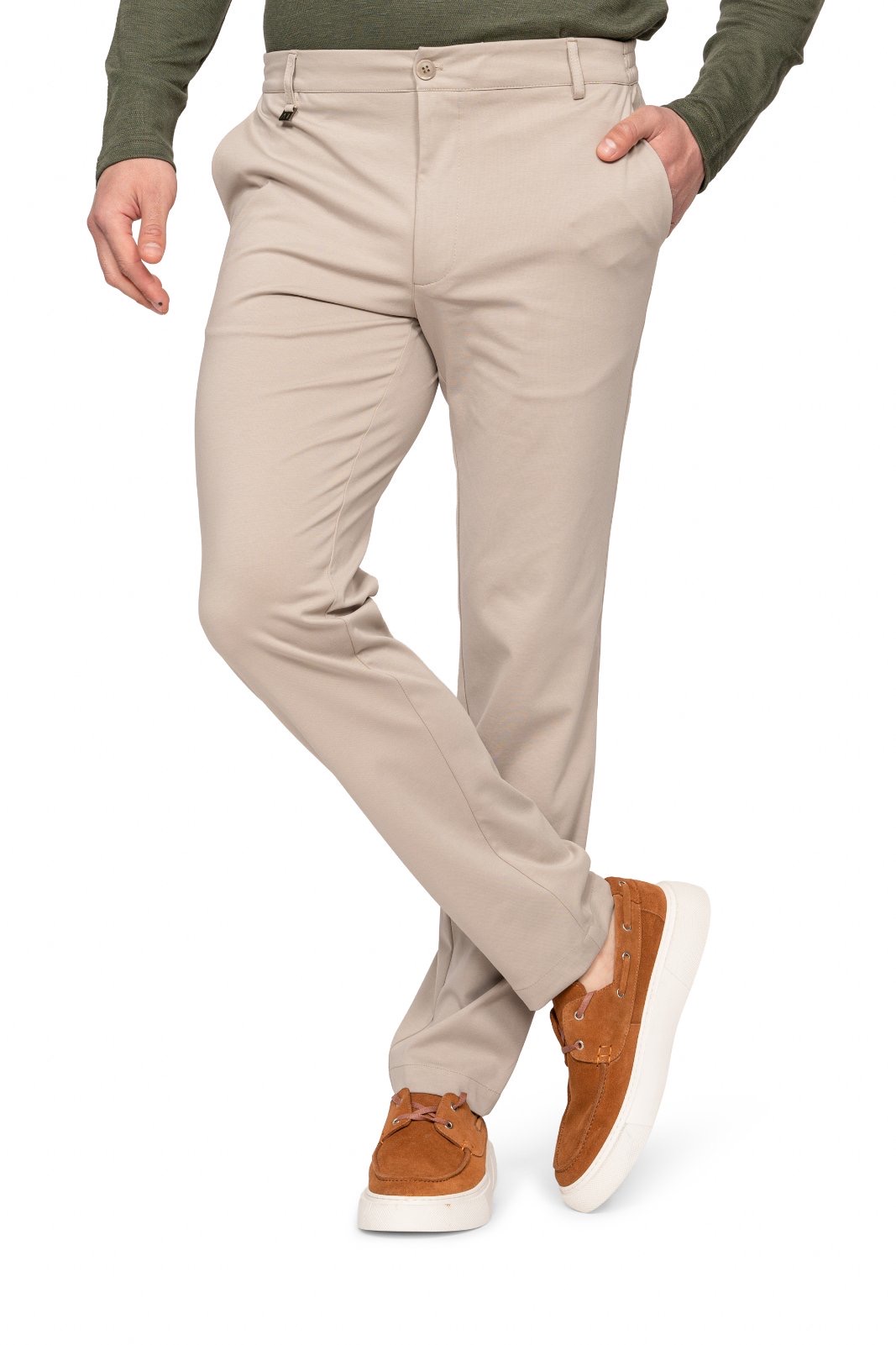 IMG_4907jpg - Noble Man wearing beige chinos with one hand in pocket and brown suede sneakers with white soles in a casual stance