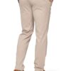 Back view of beige chinos with belt loops and back pockets; wearer in green top and tan sneakers visible