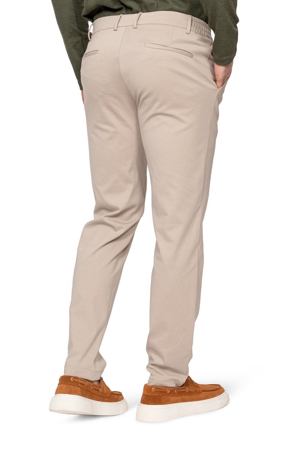 IMG_4909jpg - Noble Back view of beige chinos with belt loops and back pockets; wearer in green top and tan sneakers visible