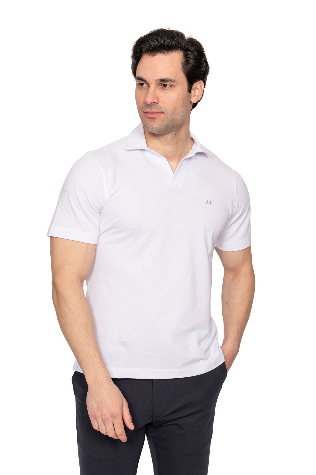 IMG_4920jpg - Noble Man wearing a white polo shirt and dark pants, looking to his left.