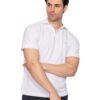 Man wearing a white polo shirt and dark pants, arms crossed, looking to his left against a plain white backdrop.