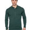 Male model wearing a dark green long-sleeve Henley shirt and beige pants, posing against a white studio background.