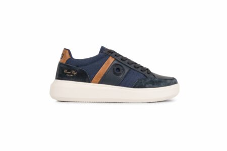 Navy blue sneaker with brown leather accents and a thick off-white sole.