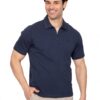 Smiling man in a navy polo shirt and beige pants poses with one hand in his pocket against a white background.