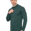Man wearing a dark green long-sleeve henley shirt with a button placket, standing against a white background.