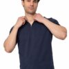 Man in a navy zip-neck shirt adjusting the zipper at the neckline.