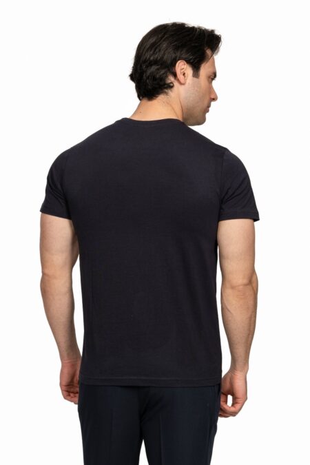 Back view of a man wearing a plain black short-sleeve T-shirt, standing against a white background.