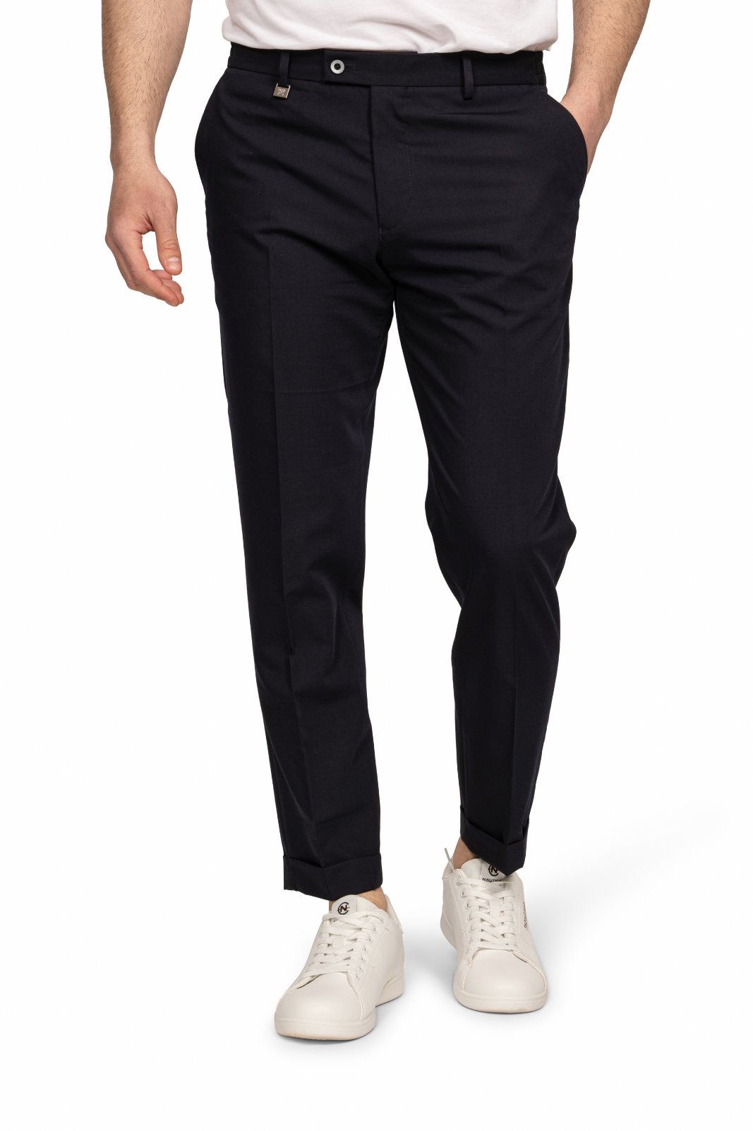 IMG_5183-6jpg - Noble Man wearing navy dress pants with white sneakers, standing with hands at sides.