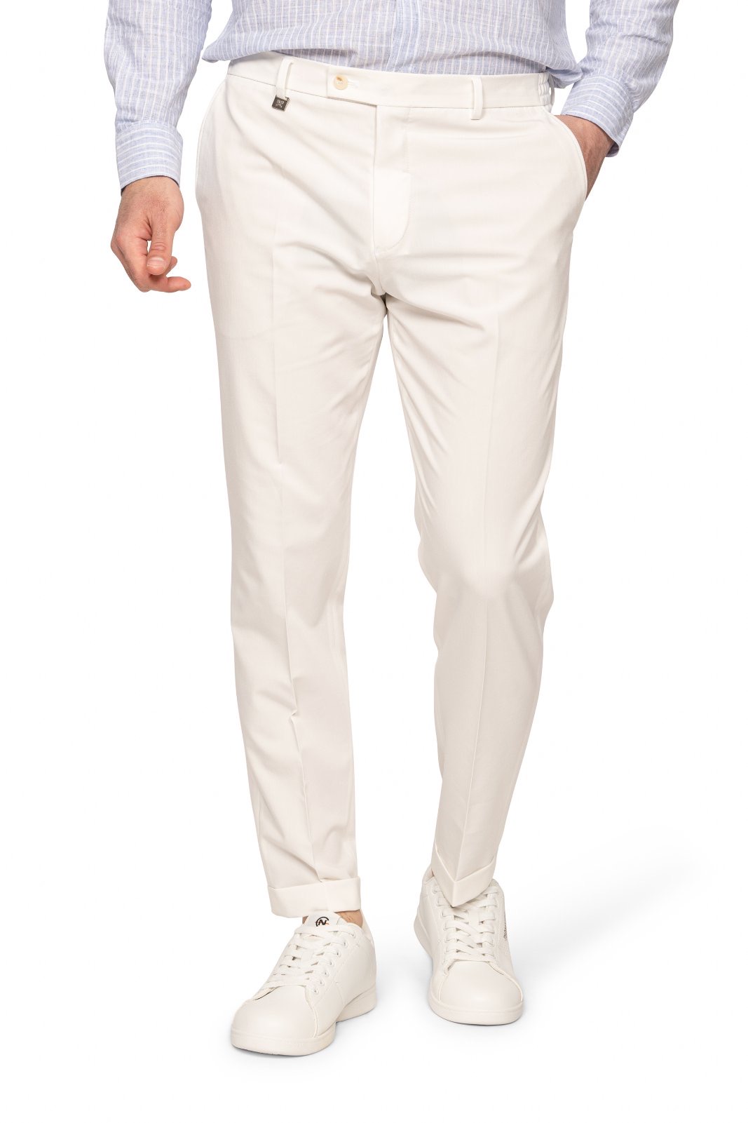 IMG_5184-1jpg - Noble Man wearing light beige chinos with cuffs, blue striped shirt, and white sneakers; casual smart outfit from the waist down to feet.