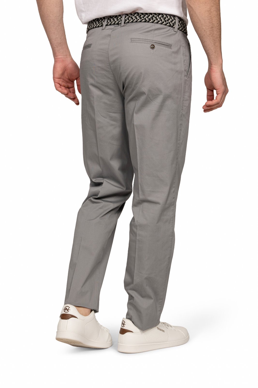 IMG_5195jpg - Noble Back view of a person wearing light gray chinos with a braided belt and white sneakers.