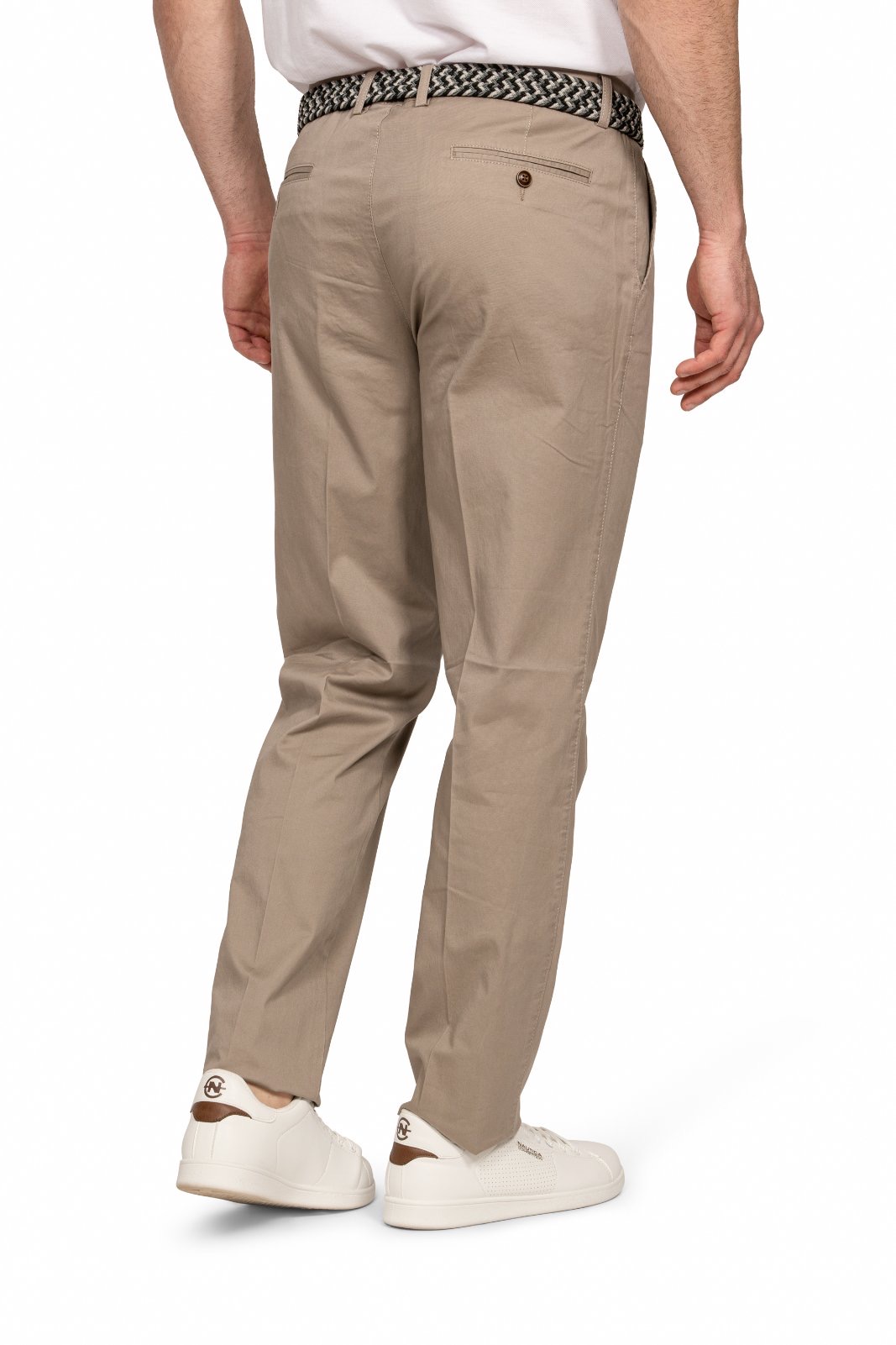 IMG_5207jpg - Noble Back view of a man wearing beige chinos with a braided belt and white sneakers.