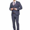 Man in a blue suit adjusts his jacket, white shirt, purple tie and brown shoes against a white background (professional portrait).