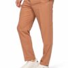 Tan chinos with a white shirt and white sneakers; hand in pocket, casual pose on white background.
