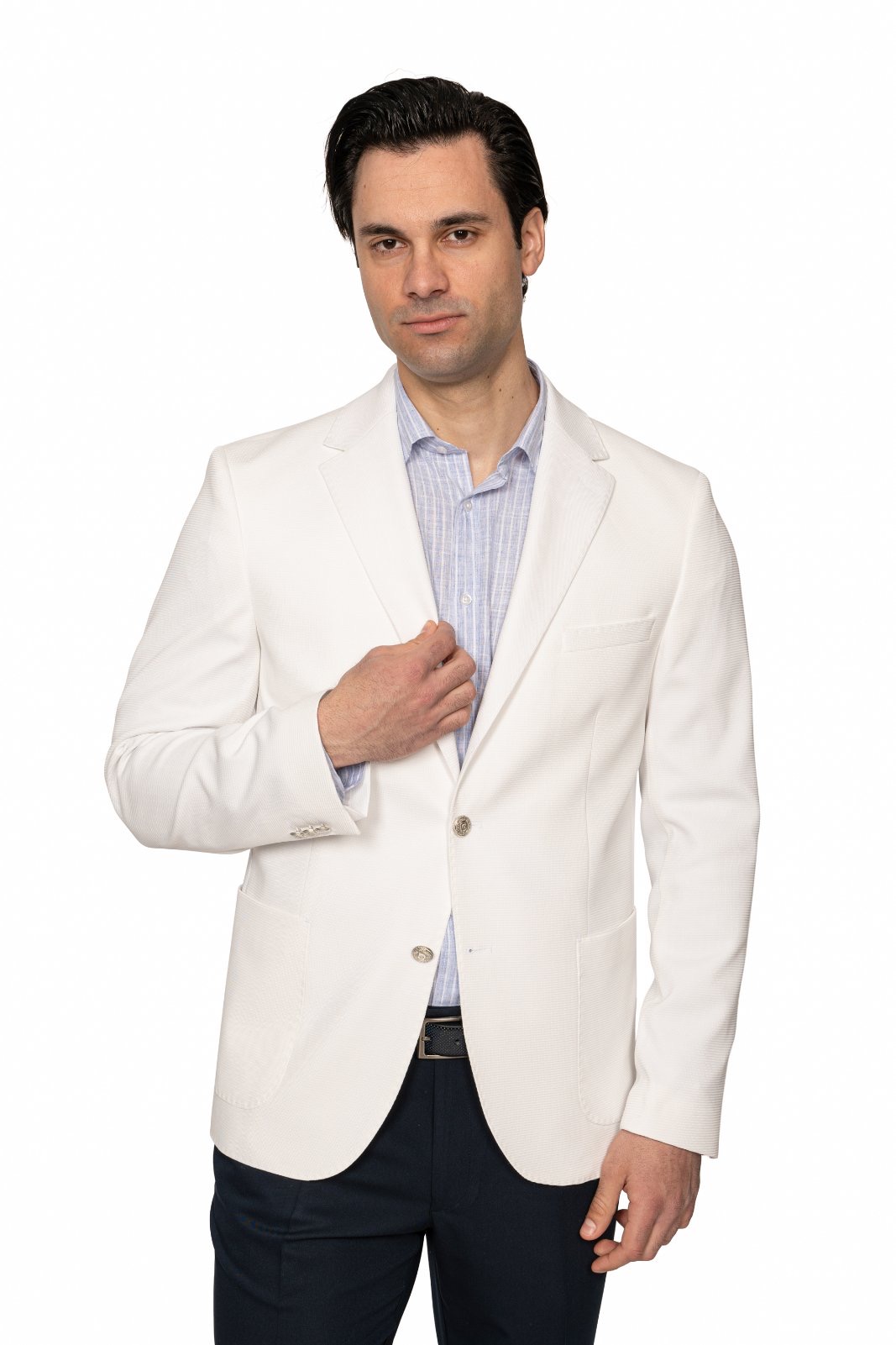 IMG_5266jpg - Noble Man in a light blue dress shirt and white blazer posing with one hand on the lapel.